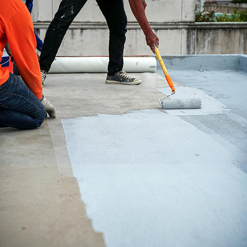 Professional waterproofing service being applied to wall